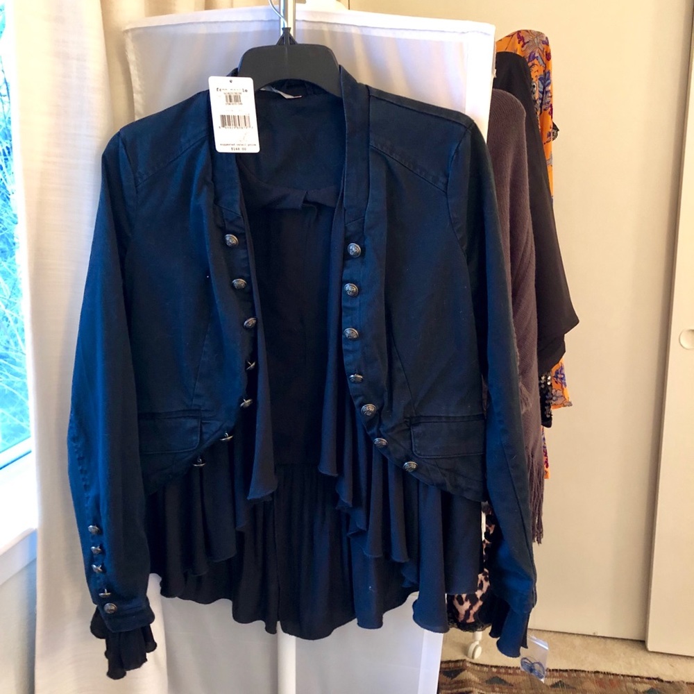 Free people jacket with ruffle hem.
